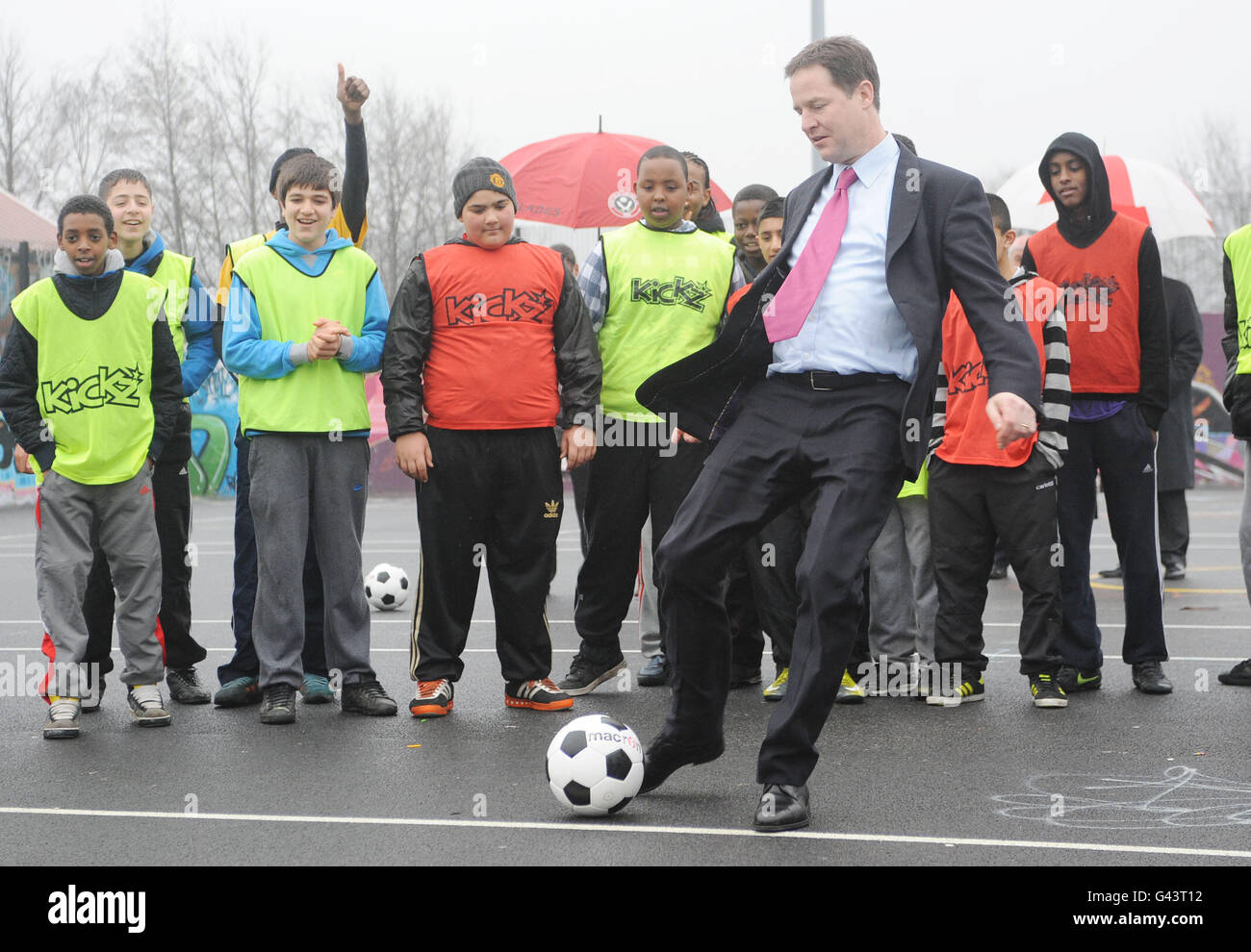 Deputy Prime Minster Nick Clegg takes a penalty kick during a training session at inner city football project, Kickz, run by Sheffield United FC, in Mount Pleasant, Sheffield. Stock Photo