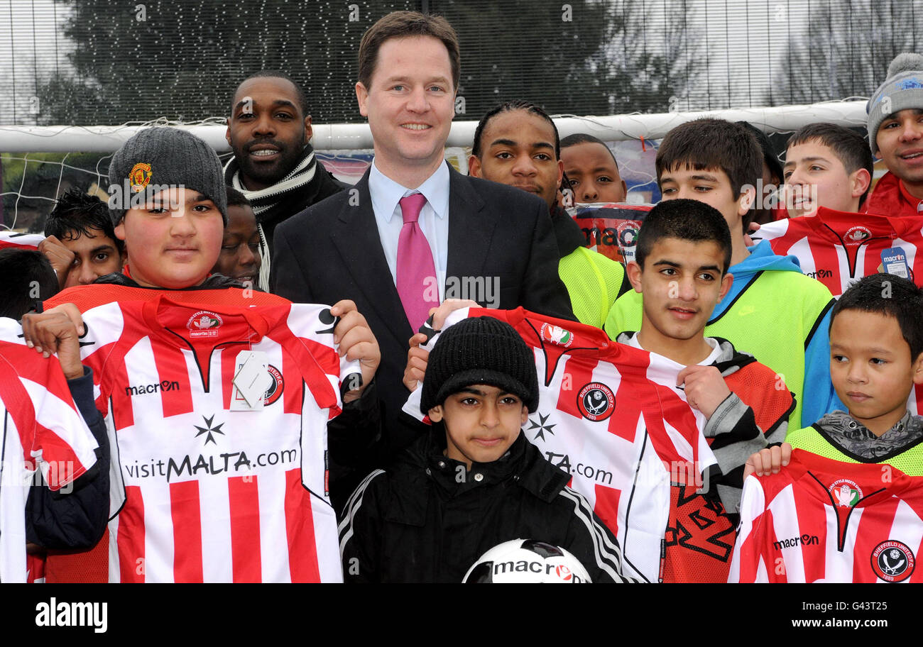Deputy Prime Minster Nick Clegg with local children during a visit to inner city football project, Kickz, run by Sheffield United FC, in Mount Pleasant, Sheffield. Stock Photo