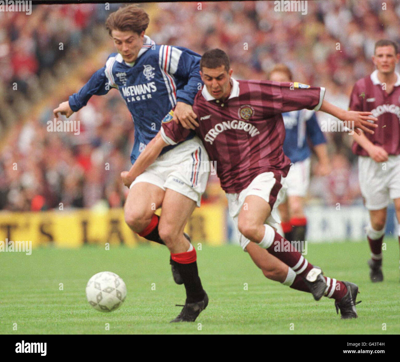 Rangers Brian Laudrup (Left) battles for the ball with Allan McManus of Hearts during the Scottish Cup Final at Hampden, Glasgow today (Saturday). Stock Photo