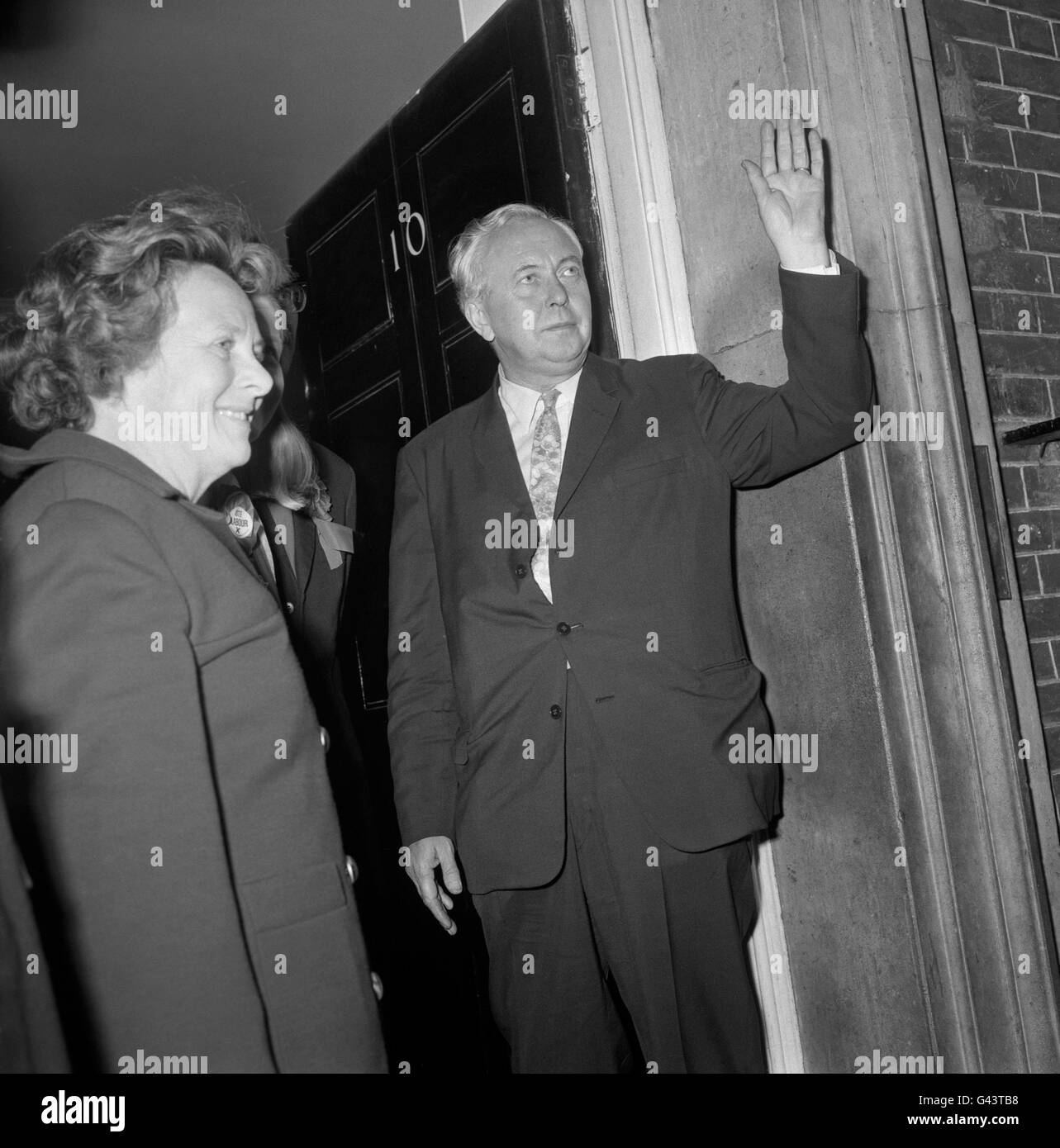Prime Minister Harold Wilson waves as he arrives back at No. 10 Downing Street after travelling through the night from his Huyton constituency. As the overnight General Election results showed probable defeat for Labour, Mr Wilson was greeted by about a dozen people in Downing Street. Stock Photo