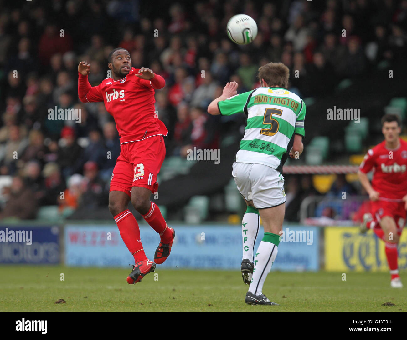 Charlton Athletic's Joe Anyinsah and Yeovil Town's Paul Huntington battle for the ball during the Npower Football League One match at Huish Park, Yeovil. Stock Photo