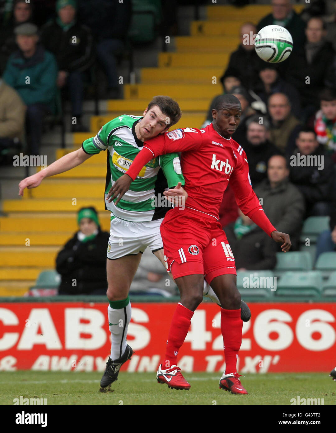 Charlton Athletic's Bradley Wright-Phillips and Yeovil Town's Paul Huntington battle for the ball during the Npower Football League One match at Huish Park, Yeovil. Stock Photo