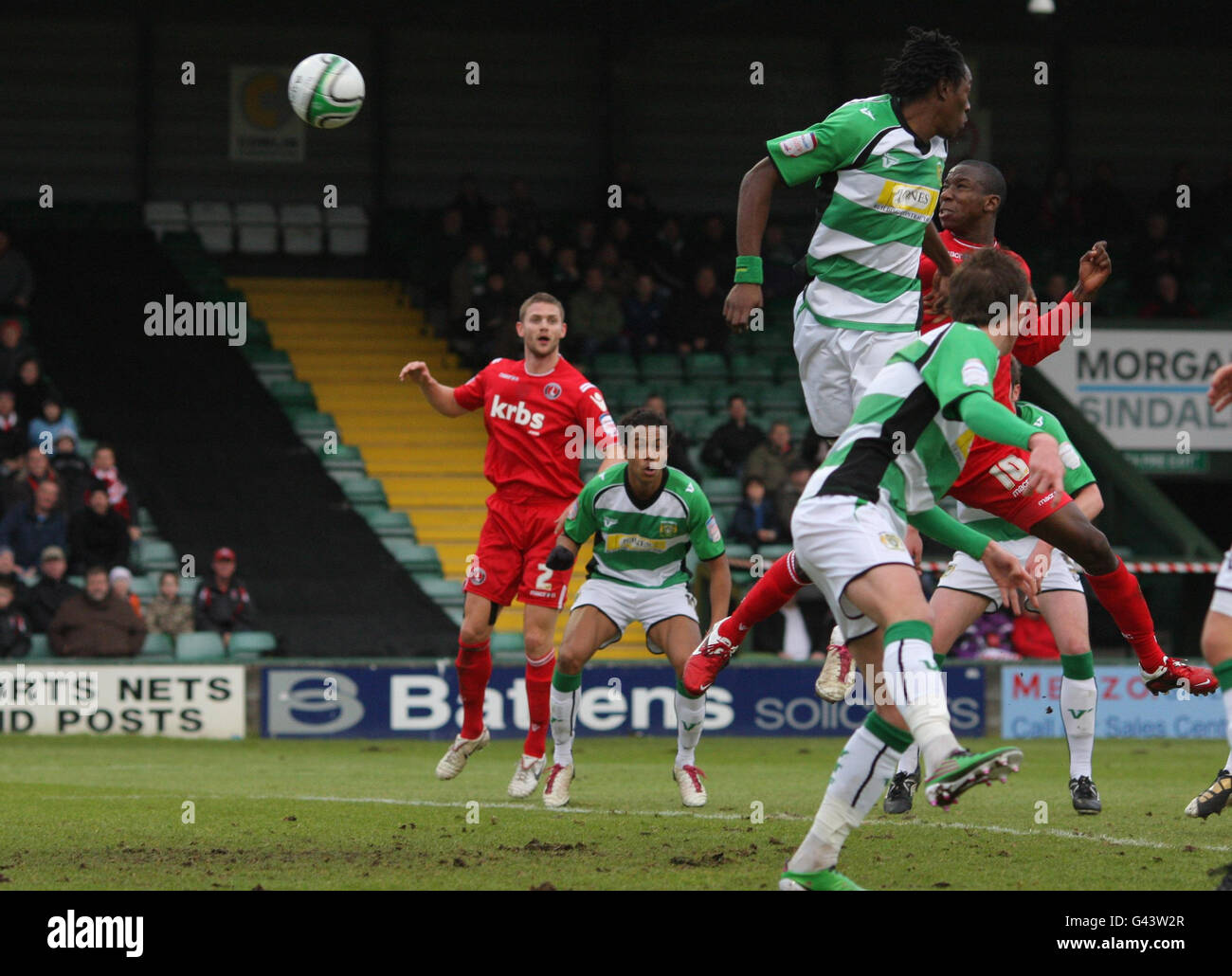 Charlton Athletic's Bradley Wright-Phillips (partially covered, right) heads the winning goal during the Npower Football League One match at Huish Park, Yeovil. Stock Photo