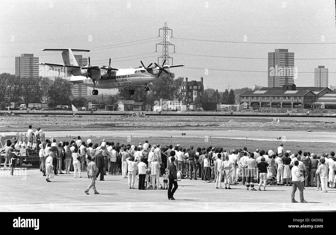 Library filer of a Brymon Airways Dash 7 aircraft making history as it becomes the first airplane to land at the London City Airport. The loss-making airport, based in London's Docklands, has been sold to Irish businessman Dermot Desmond for 14.5 million, it was announced. Stock Photo