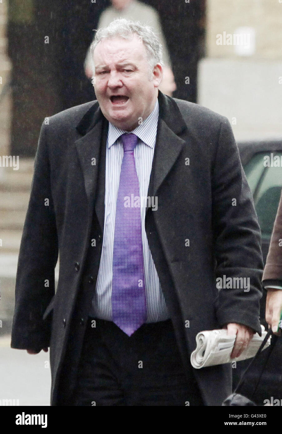 Jim Devine arrives at Southwark Crown Court as the jury in the trial of