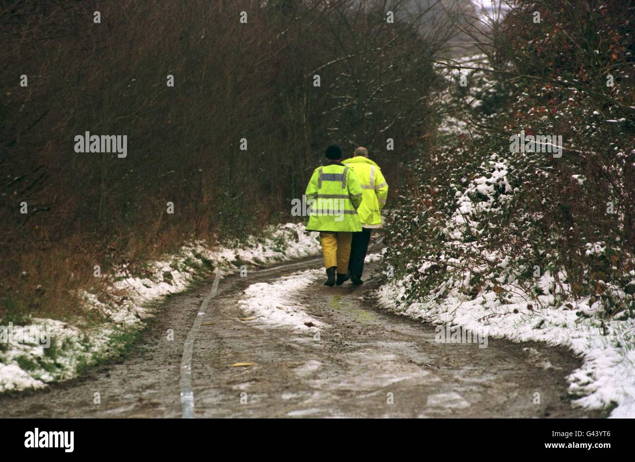Police search the lane in which a Range Rover car was found with three bodies inside by a local farmer early this morning (Thursday). The murder site in a lane off the A130 between Chelmsford and Southend, near Rettenden, Essex, was sealed off by police who said the men had all been shot at close range. Stock Photo
