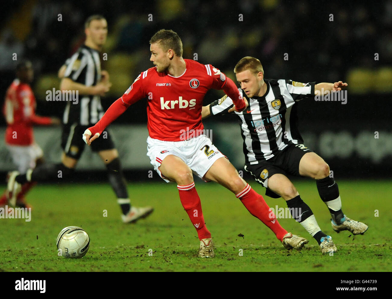 Notts County's Conor Clifford (right) and Charlton Athletic's Simon Francis battle for the ball during the npower Football League One match at Meadow Lane, Nottingham. Stock Photo