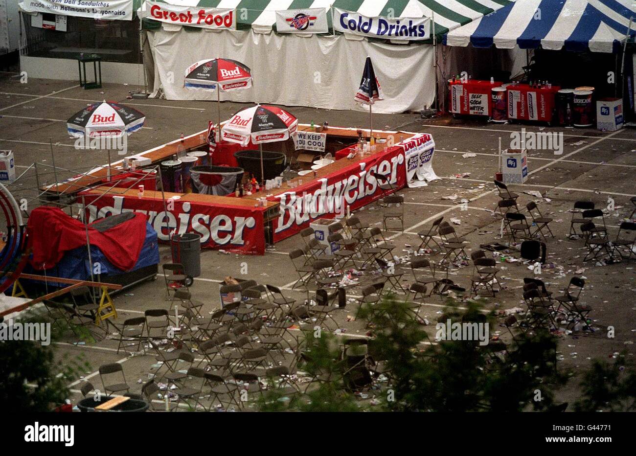 Chairs and tables are strewn around a bar adjacent to Centennial Park this morning (Saturday) following last night's bomb explosion in which two people died. Photo by John Giles/PA. Stock Photo