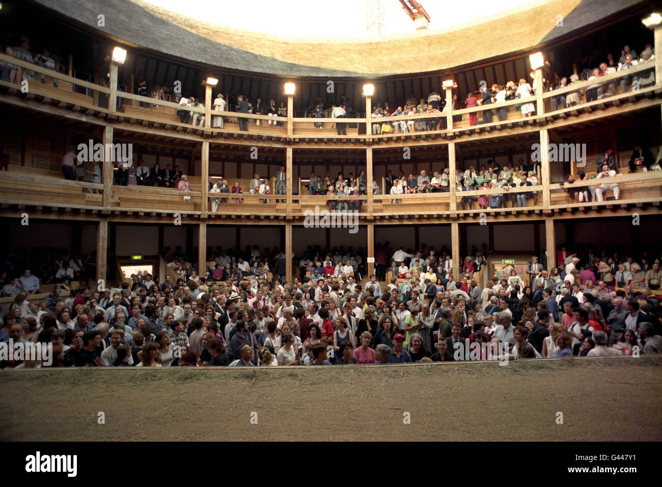 The audience waits in anticipation before the inaugural performance of Shakespeare's 'The Two Gentlemen of Verona' at the new Globe Theatre, on London's Southbank. Theatre bosses had a last minute search to replace injured actor George Innes, who broke his leg on Tuesday night during public rehearsals for the play. Stock Photo