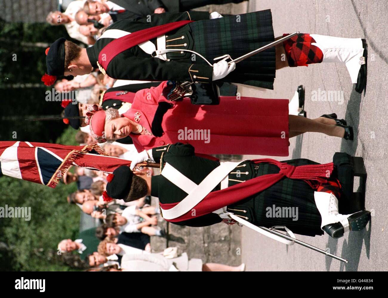 The Queen presents the new colours to the Royal Guard during a ceremony at Balmoral today (Saturday). The Guard, which this year is formed from the 1st battalion The Black Watch, recieved the first colours since 1973, the ceremony being held every twenty years or so. The Black Watch last had the privilige of forming the Royal Guard in 1987. PA. Stock Photo