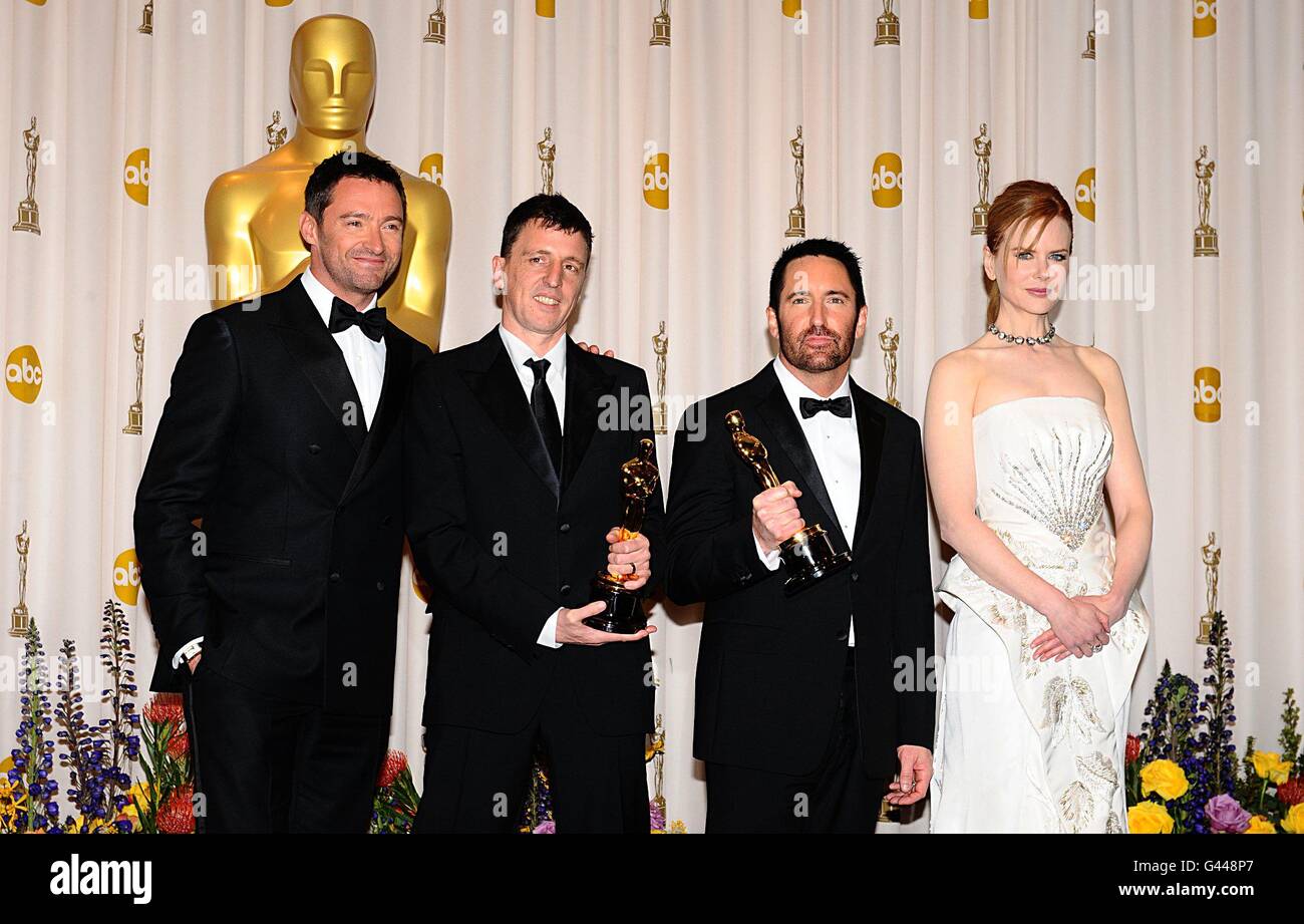 ** Trent Reznor and Atticus Ross with the Best Original Score award, received for The Social Network, with Hugh Jackman and Nicole Kidman at the 83rd Academy Awards at the Kodak Theatre, Los Angeles. Stock Photo