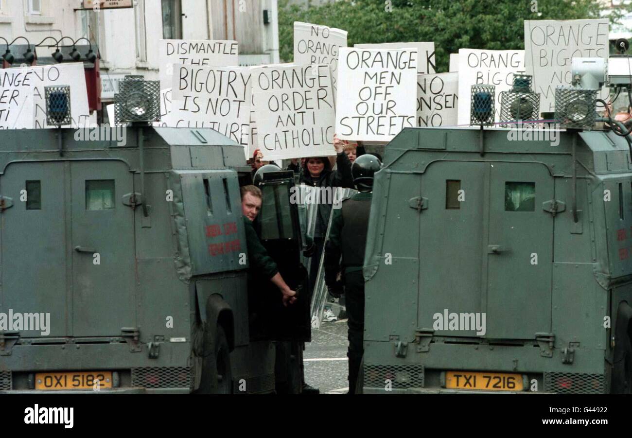 RUC officers seperate Nationalist protestors and a Royal Black ...