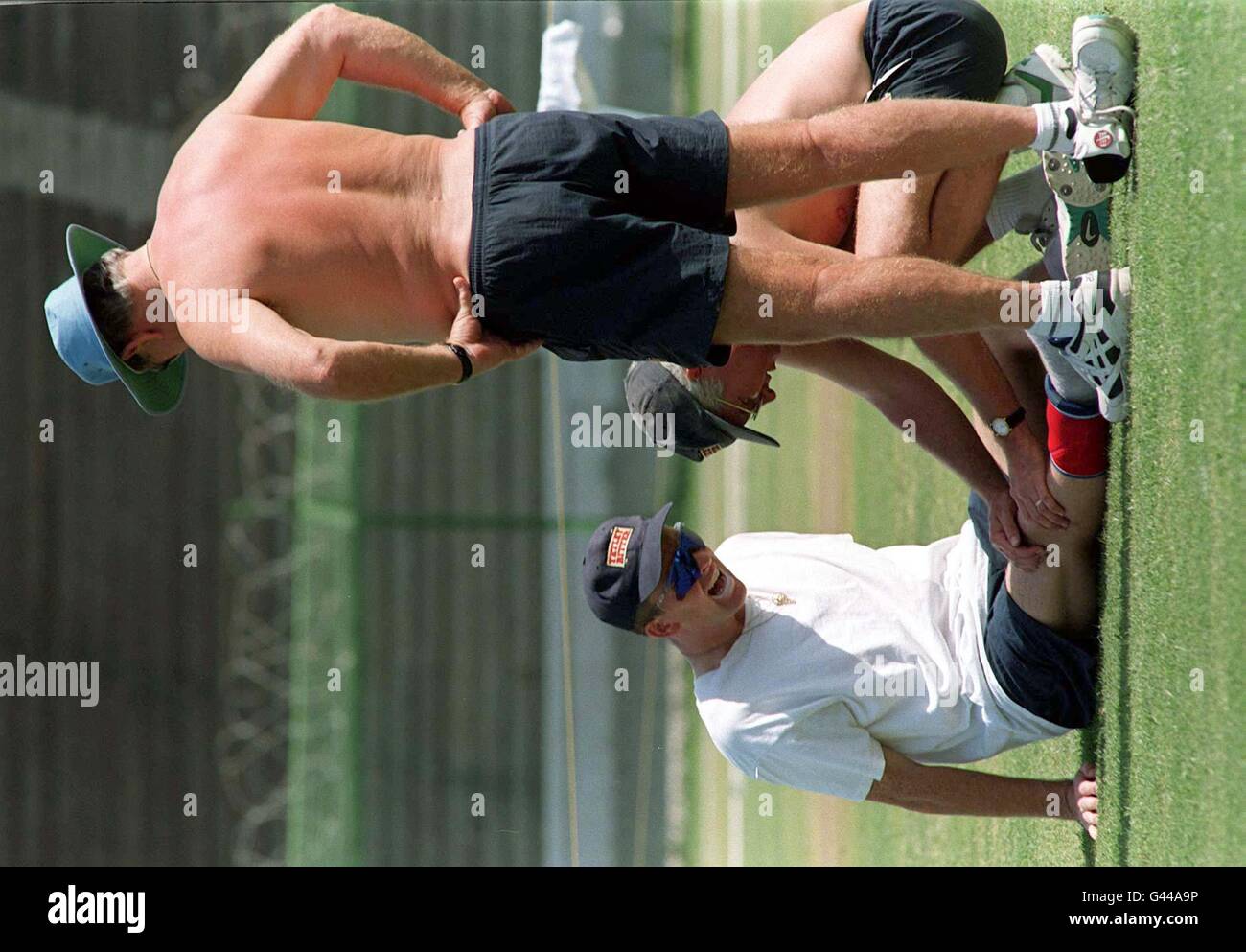 England bowler Dominic Cork is treated for his knee injury by team Doctor Philip Bell and