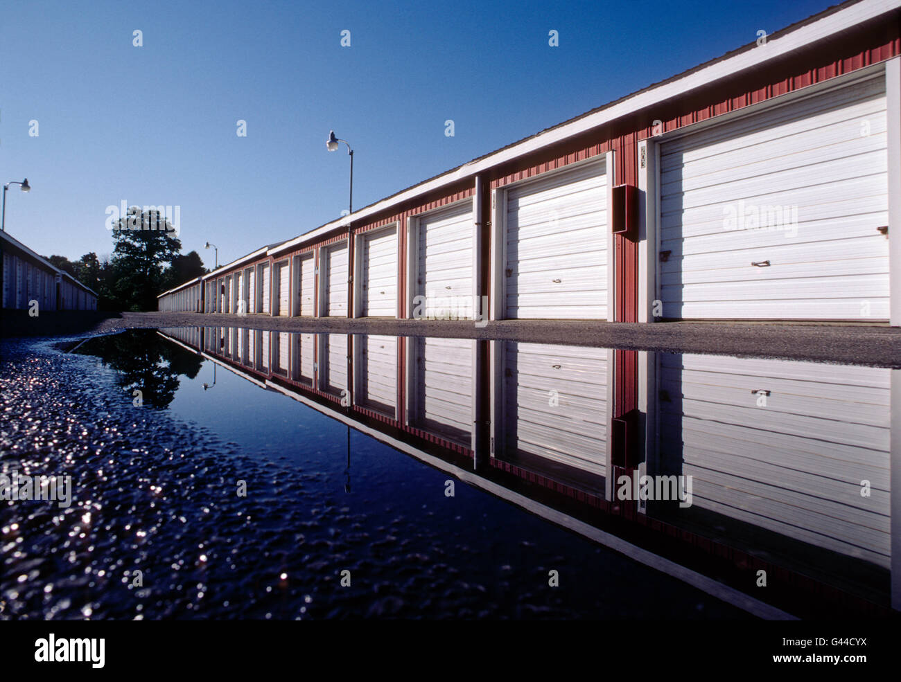 Daytime view of garage like rental storage units lined up in a row Stock Photo