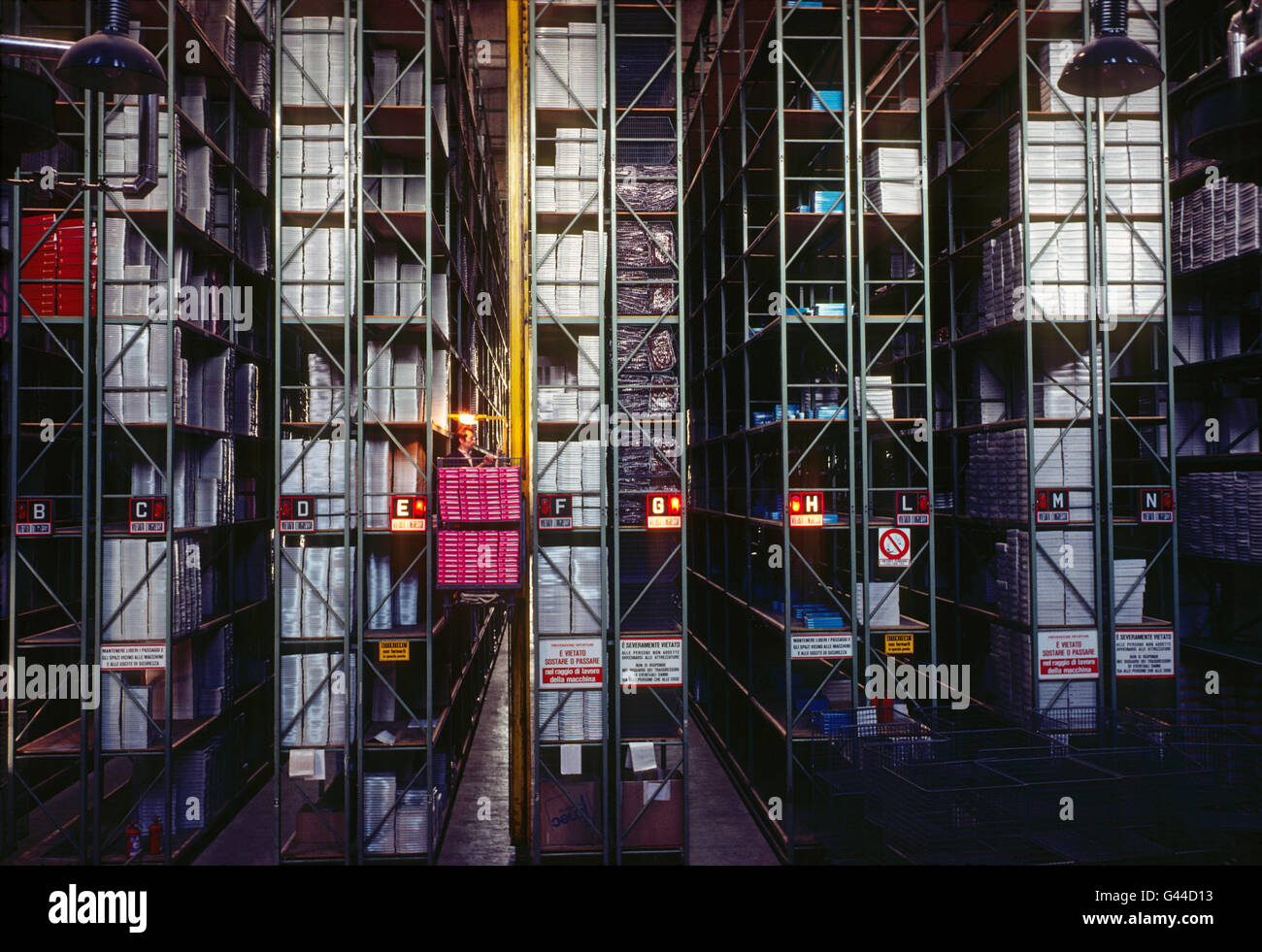 Automated forklift - elevator working in a large distribution warehouse Stock Photo