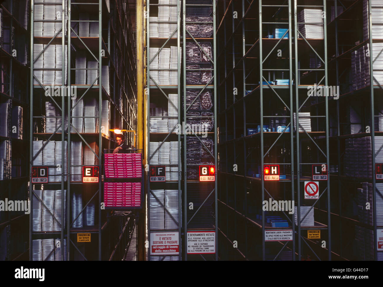 Automated forklift - elevator working in a large distribution warehouse Stock Photo