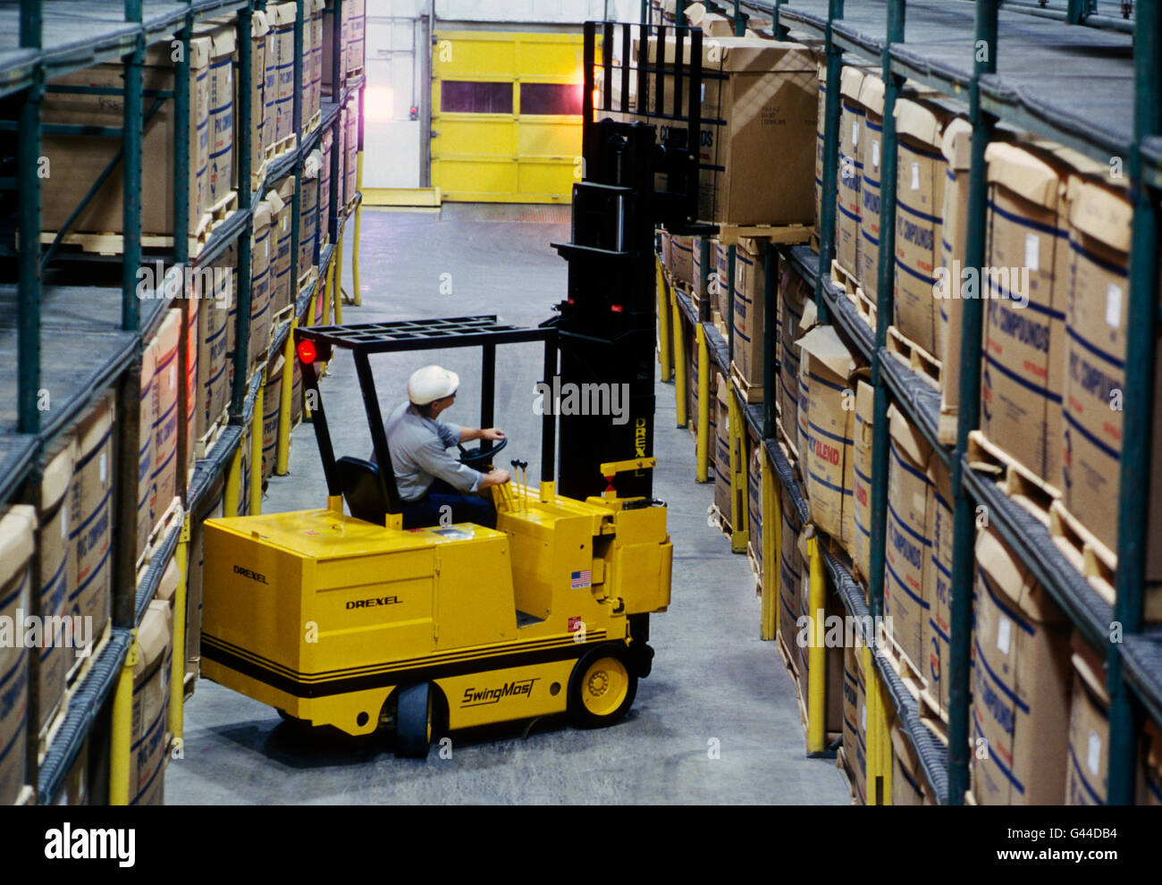 Forklift working in a large distribution warehouse Stock Photo Alamy