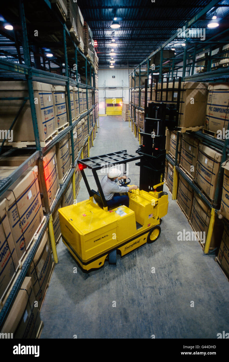 Forklift working in a large distribution warehouse Stock Photo