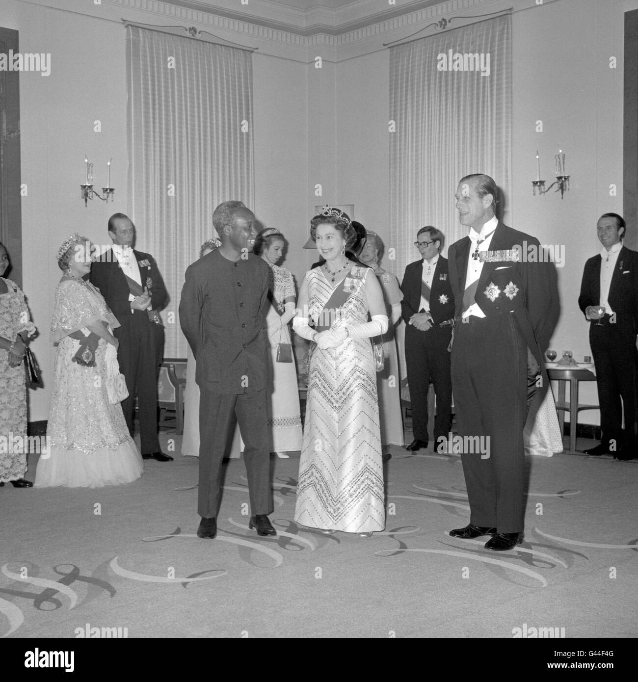 President Julius Nyerere of Tanzania, entertains the Queen and the Duke of Edinburgh (foreground, left to right) and other member's of the Royal Family, with a banquet at Claridge's Hotel. Stock Photo