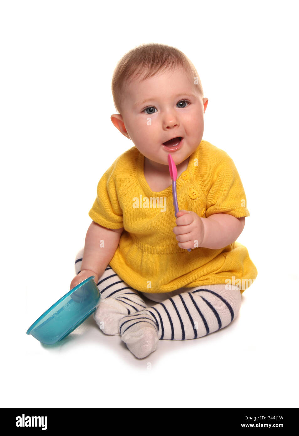 Baby girl with a bowl and spoon cutout Stock Photo Alamy