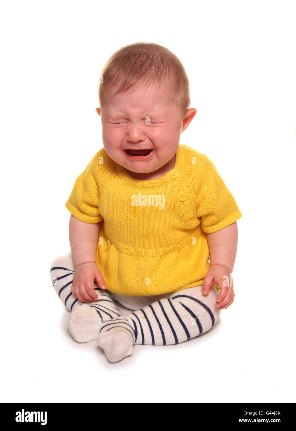 Baby girl crying studio cutout Stock Photo