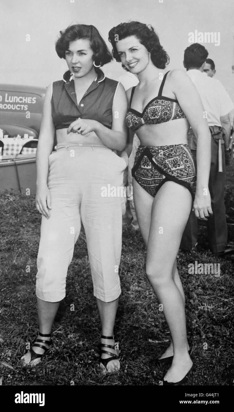 American actress Jane Russell on location for her new film RKO's 'Underwater!', on the island of Hawaii, talks to her stand-in for the underwater scenes, Carmen Nisbet. Stock Photo