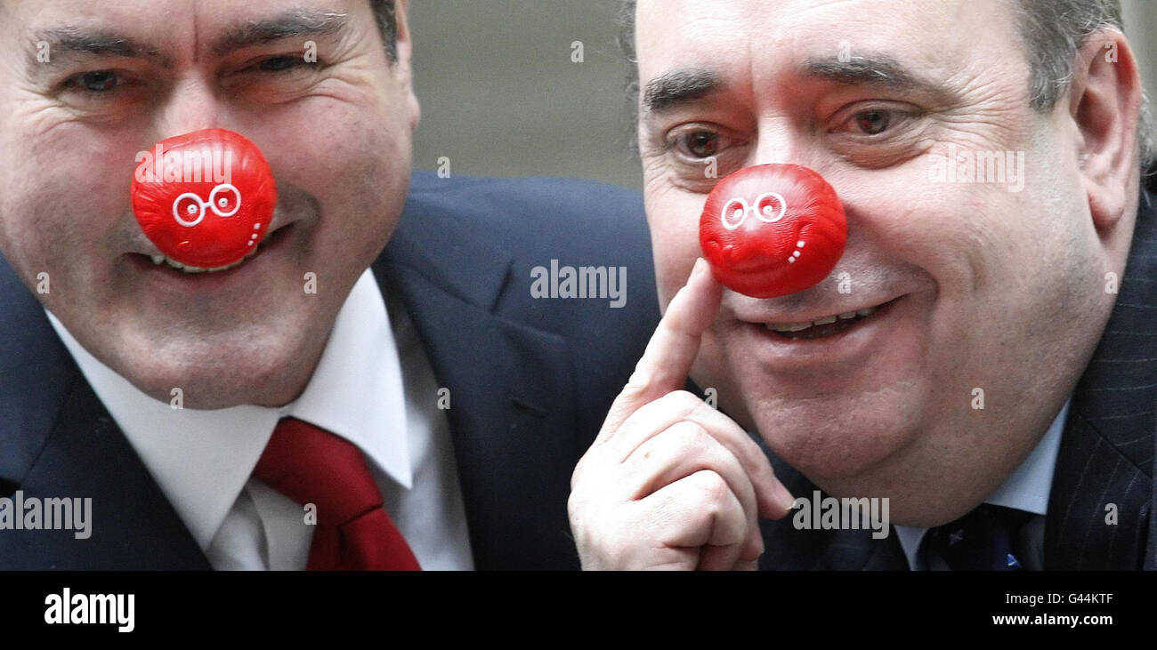 First Minister Alex Salmond (right) and Leader of the Scottish Labour Party Iain Gray wear red noses in support of comic relief at The Scottish Parliament in Edinburgh. Stock Photo