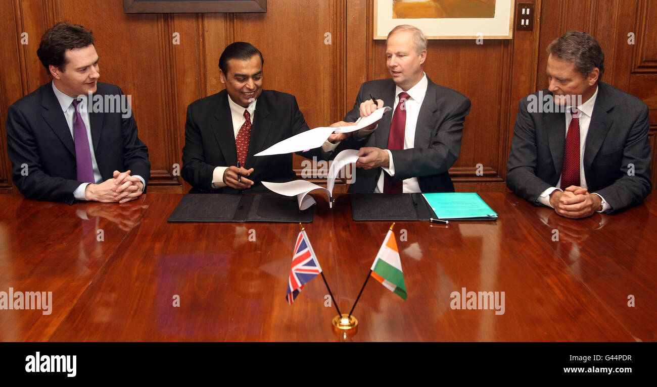 (left to right) Chancellor George Osborne, Mukesh Ambani, Chairman and Managing Director of Reliance Industries, Robert Dudley, CEO of BP and Carl-Henric Svanberg, Chairman of BP during a signing ceremony at 11 Downing Street. Stock Photo