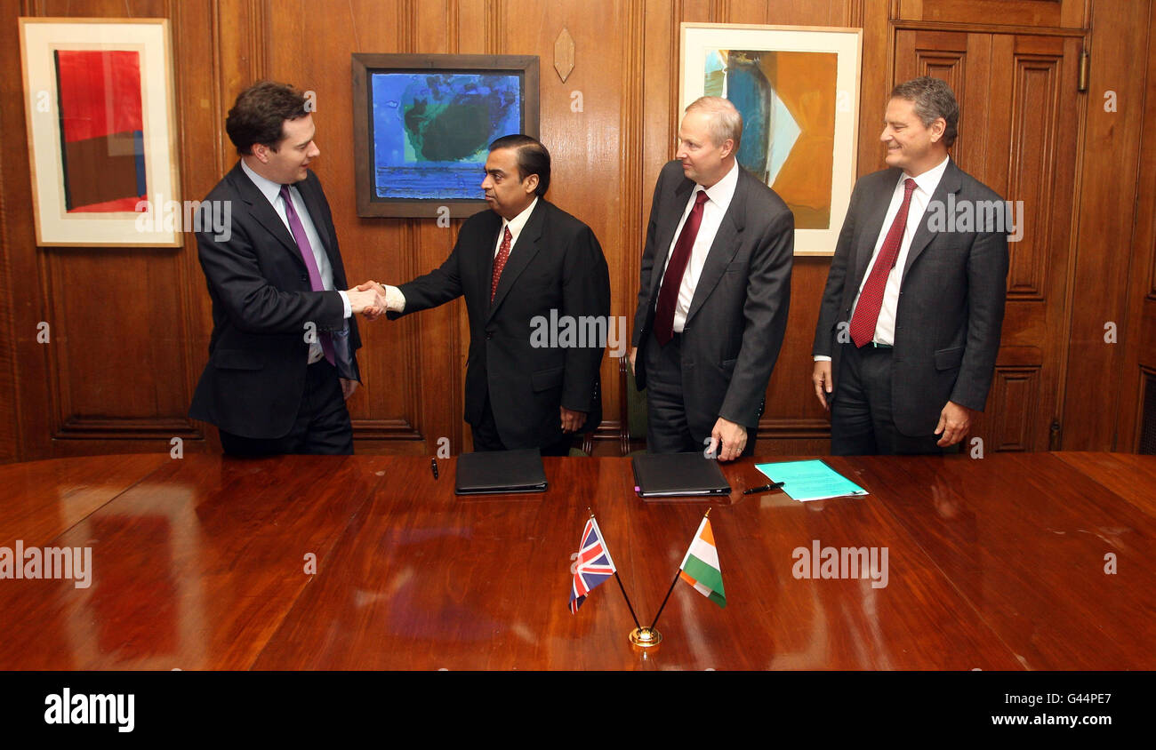 (left to right) Chancellor George Osborne, Mukesh Ambani, Chairman and Managing Director of Reliance Industries, Robert Dudley, CEO of BP and Carl-Henric Svanberg, Chairman of BP during a signing ceremony at 11 Downing Street. Stock Photo