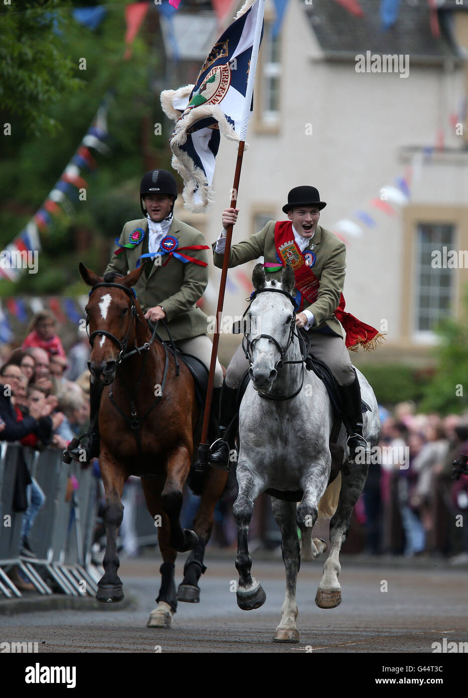 Royal Standard Bearer Rory J. Monks (right) leads riders taking part in
