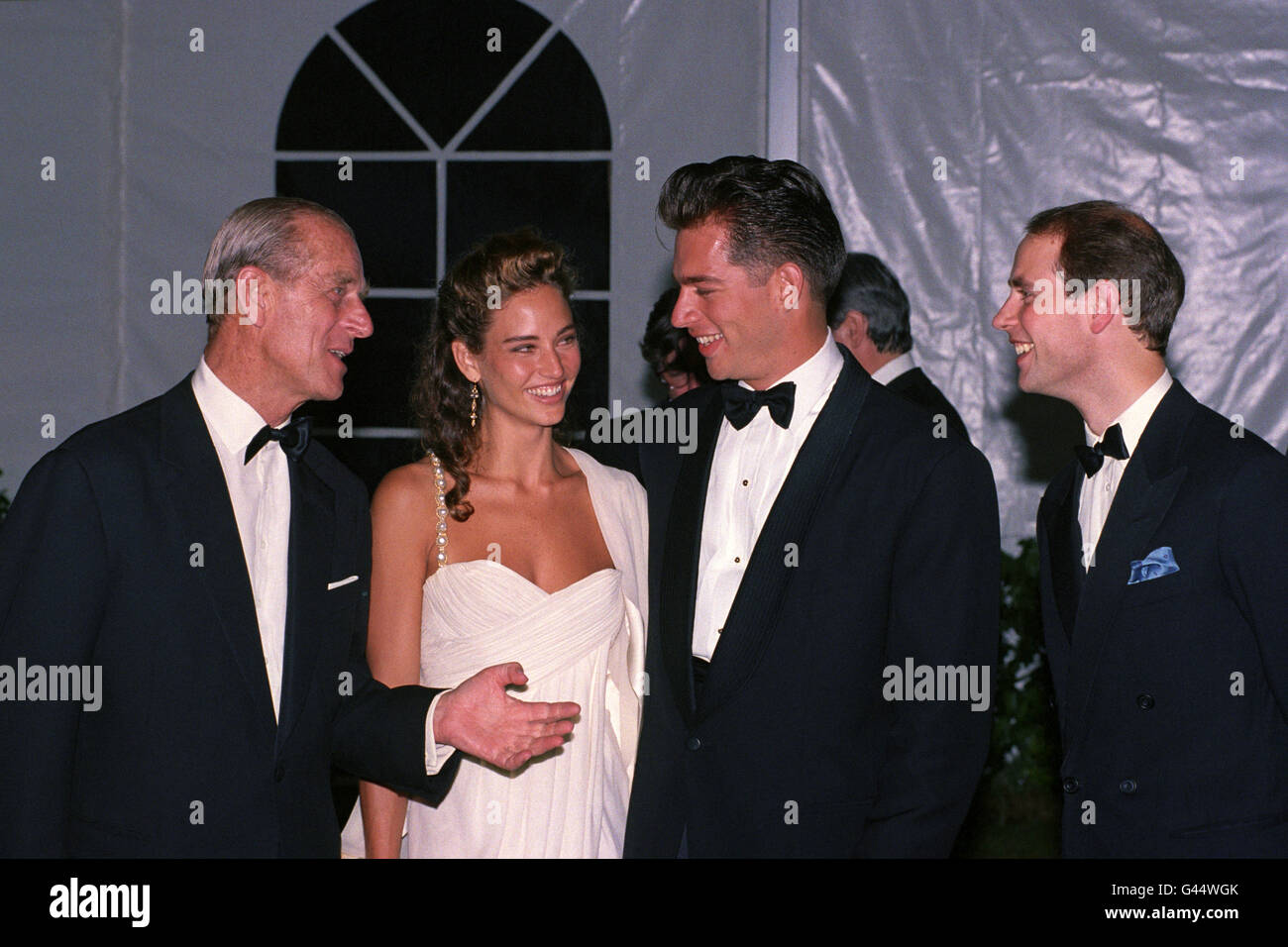 The Duke of Edinburgh and Prince Edward chat with American musician and singer Harry Connick Jnr and his girlfriend, Jill Goodacre before a gala dinner in the grounds of Windsor Castle to celebrate the Duke's 70th birthday and to raise funds for his charities. Stock Photo