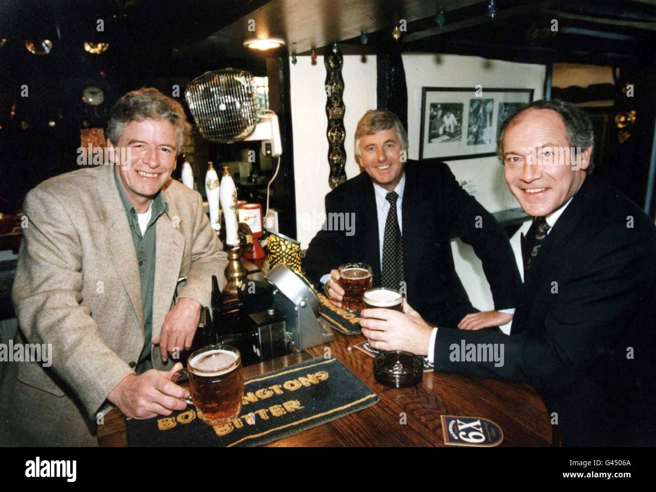Paul Smith (far right), Chief Executive of Discovery Inns, and his Finance Director Philip Cropley (centre), enjoying a pint with actor Alan Devereux who plays Sid Perks, the fictional landlord in the radio serial The Archers, in the bar of The Old Bull at Inkberrow, one of its 279 pubs and the inspiration for The Bull in The Archers' village of Ambridge. It was annopunced today (Sunday) that pre-tax profits for the group rose by 50% to 3 million. See PA Story CITY Discovery/PA. Stock Photo