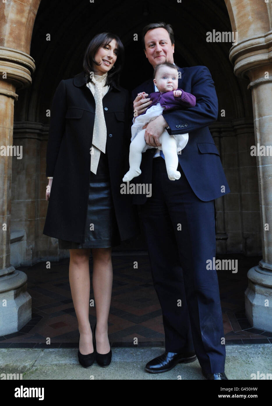 Prime Minister David Cameron and his wife Samantha with their daughter Florence Rose Endellion at St Mary Abbots Church in South Kensington, west London today, after the christening of their youngest child who was born in Cornwall last August. Stock Photo