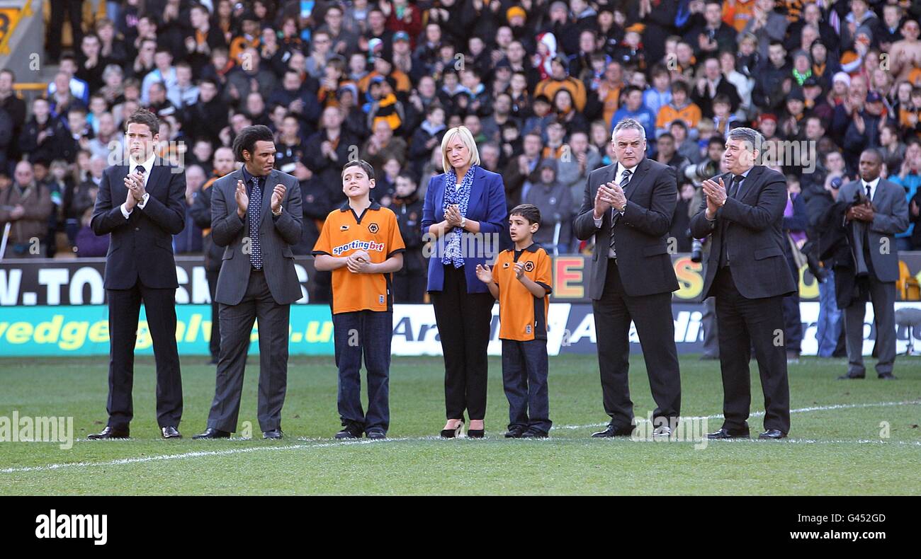 (left to right) James Beattie, Don Goodman, Dean Richard's widow Samantha, sons Rio and Jaden, Dave Jones and Graham Taylor on the pitch as part of the tribute for the former Wolverhampton Wanderers and Tottenham Hotspur player Stock Photo