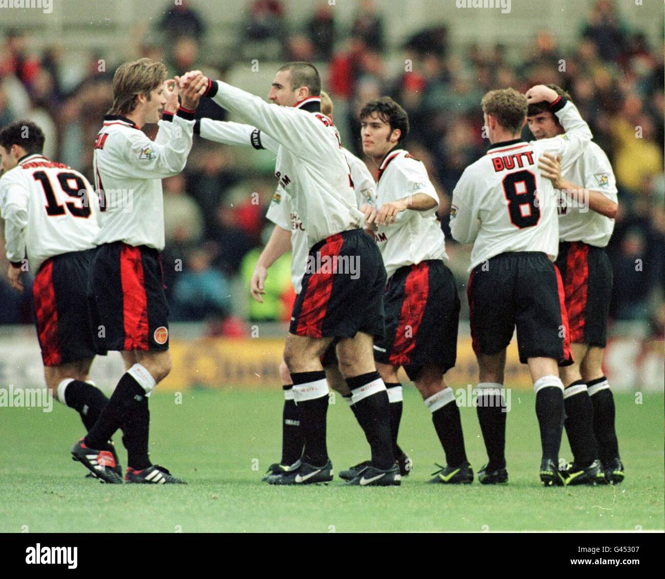 Roy Keane is mobbed by Manchester United team mates after his first goal at Middlesbrough today (Saturday). Photo by Owen Humphreys/PA Stock Photo