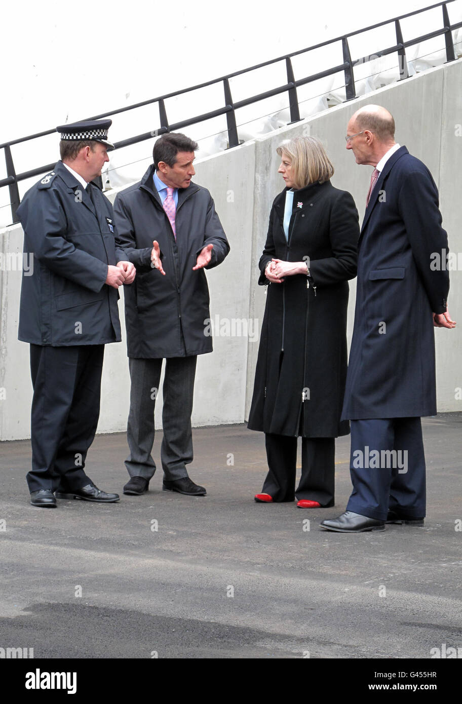 Home secretary Theresa May speaks with (from the left) Chris Allison,  Metropolitan Police Assistant Commissioner in charge of national Olympic  safety and security coordination, Lord Coe and Chairman of the ODA John