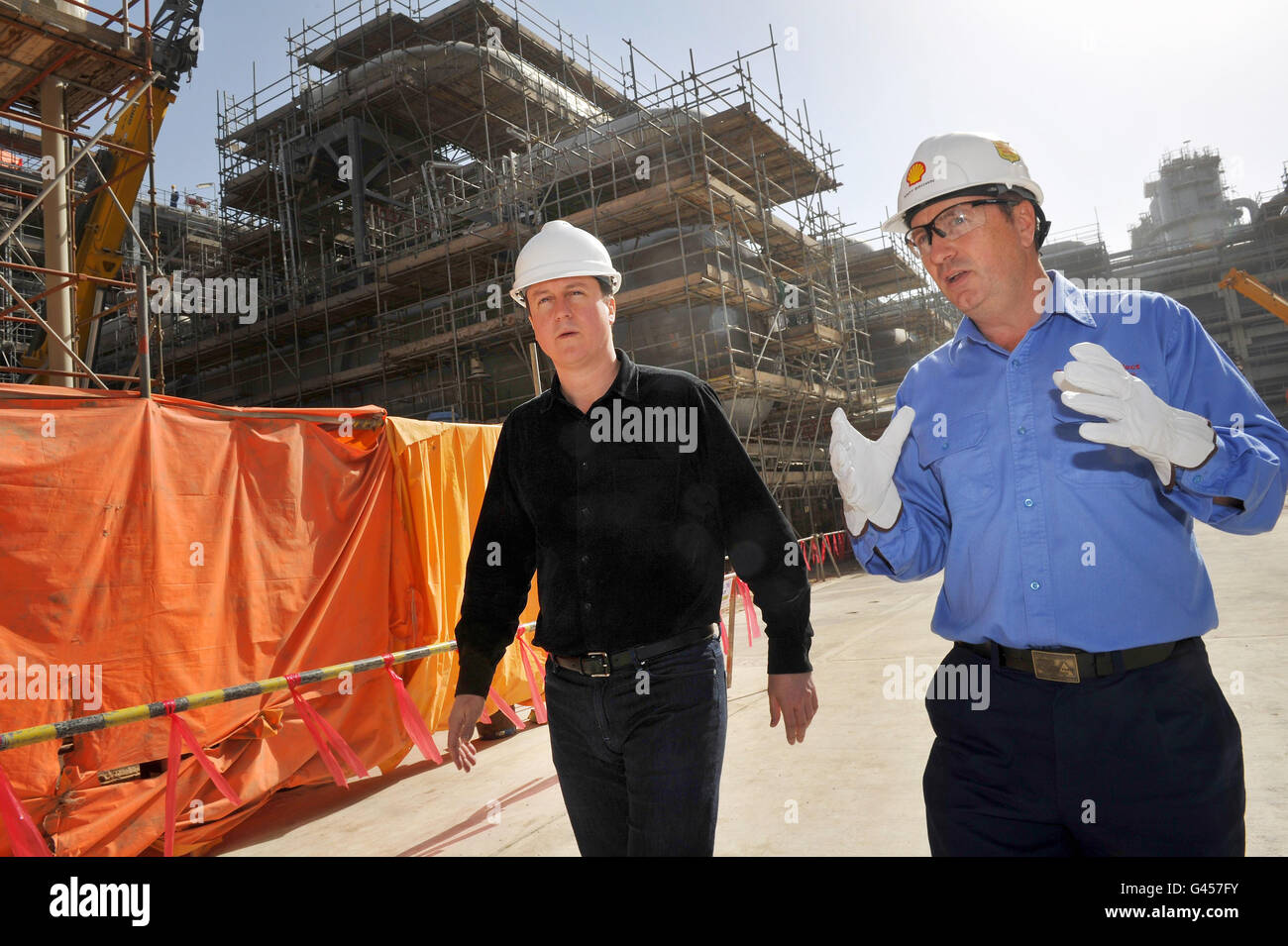 British Prime Minister David Cameron (left) visits Shell's vast new gas-to-liquid facility in Qatar, known as Pearl, with Shell executive vice president and Pearl boss Andy Brown. Stock Photo