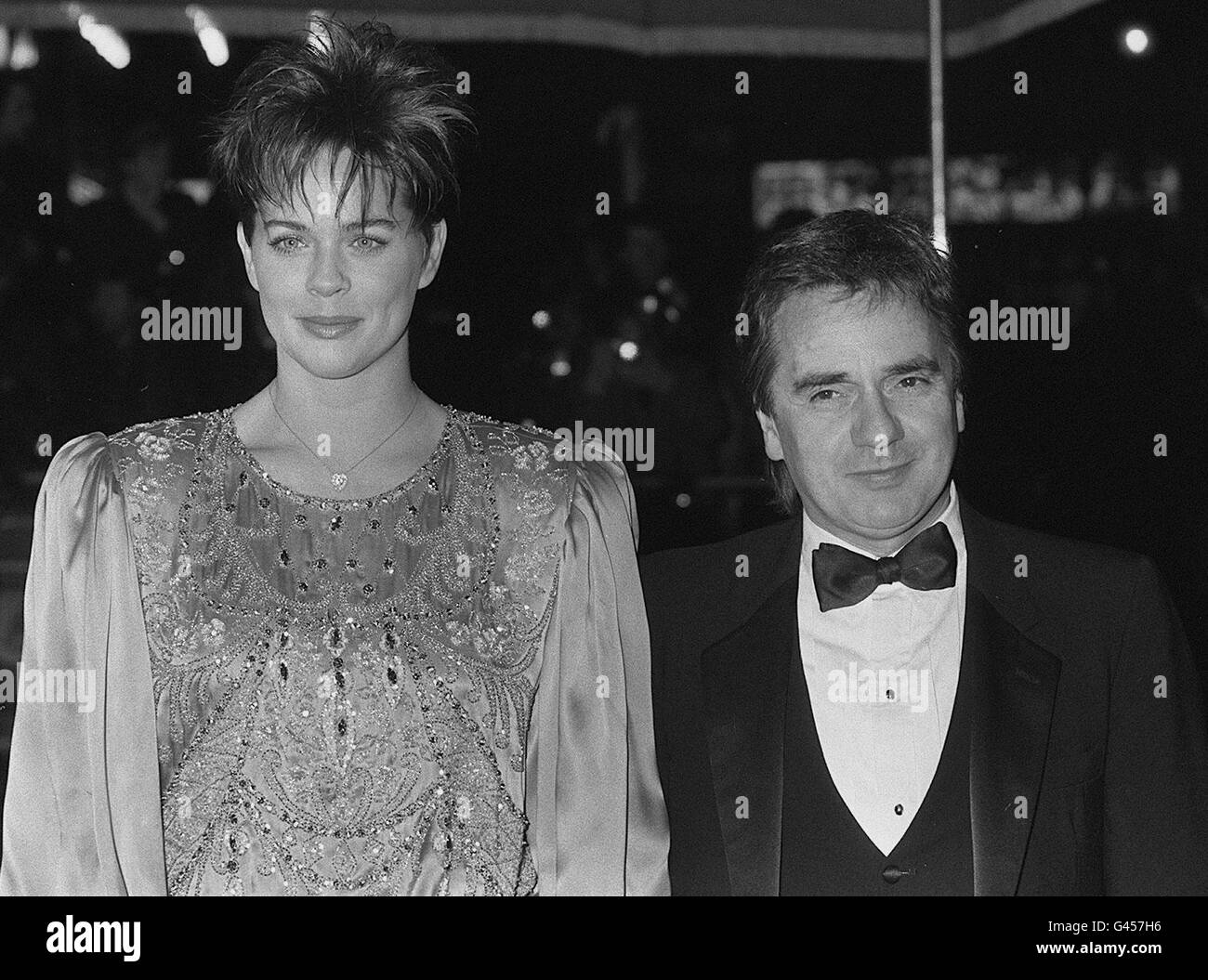 Comedian and actor Dudley Moore arrives with girlfriend Brogan Lane for the Royal premiere of his latest film 'Santa Claus - The Movie', attended by Diana, Princess of Wales, at the Empire Leicester Square in London. * Lane later became his third wife. 12/6/96: Moore has filed for divorce from his fourth wife, Nicole Rothschild, after just over two years of marriage. Stock Photo