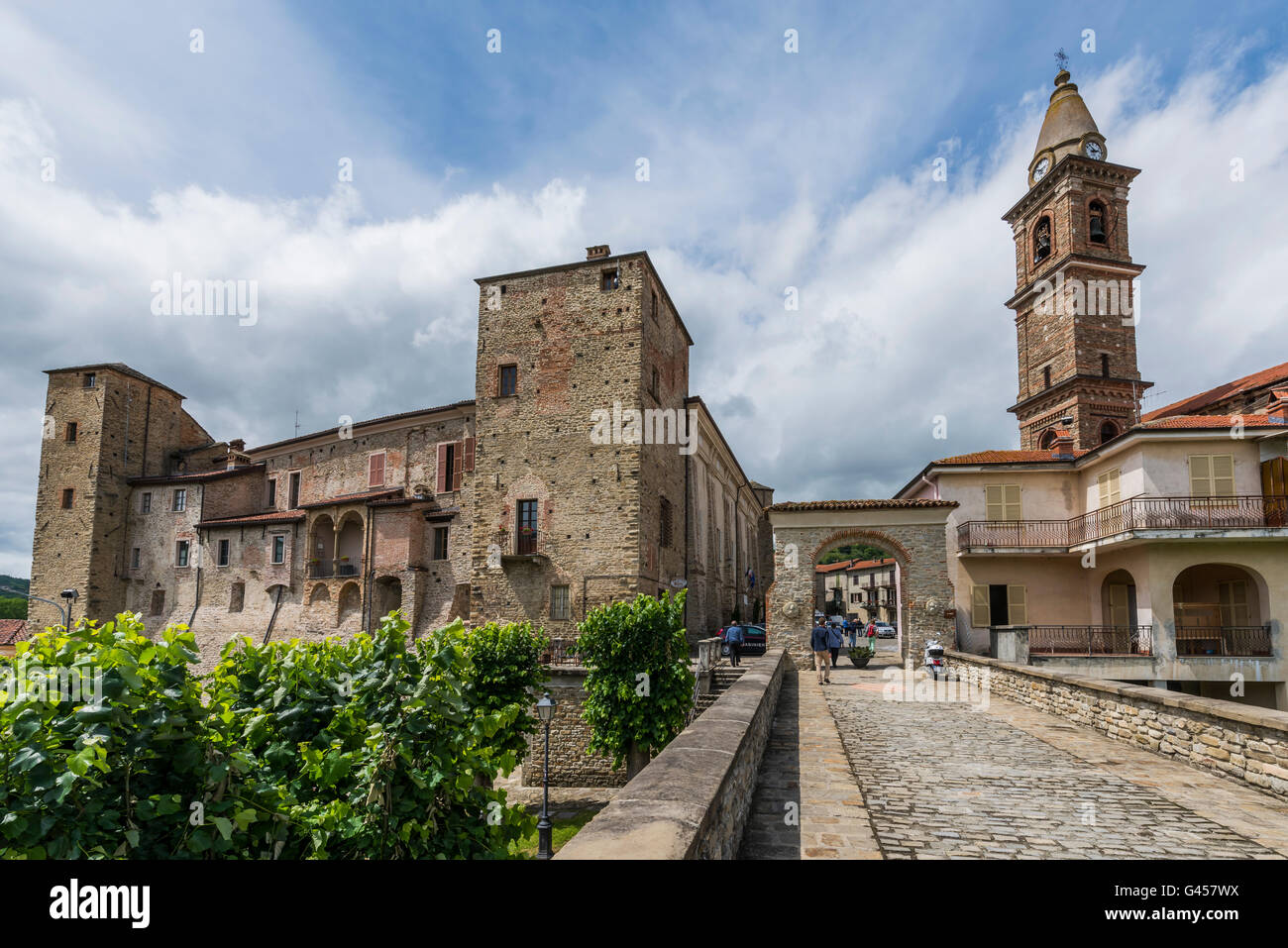 Monastero Bormida, Italy - May 29, 2016: Bridge, houses and Church of Monastero Bormida in Piedmont, Italy Stock Photo