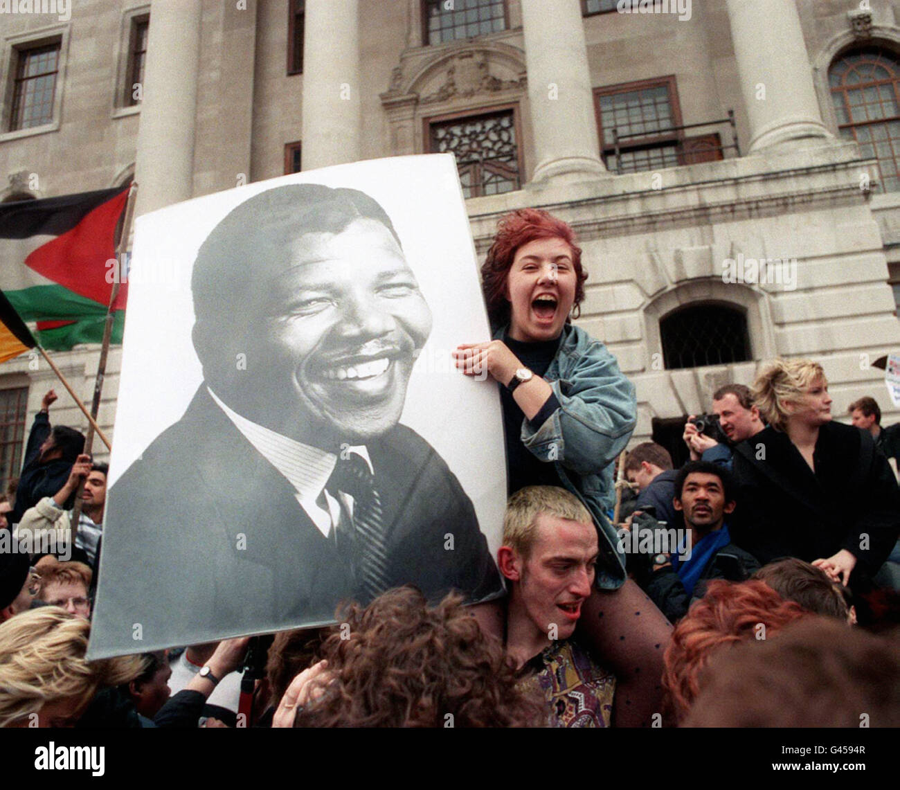 Celebrations near the South African Embassy in Trafalgar Square on the announcement of the release of Nelson Mandela from a South African prison. Stock Photo