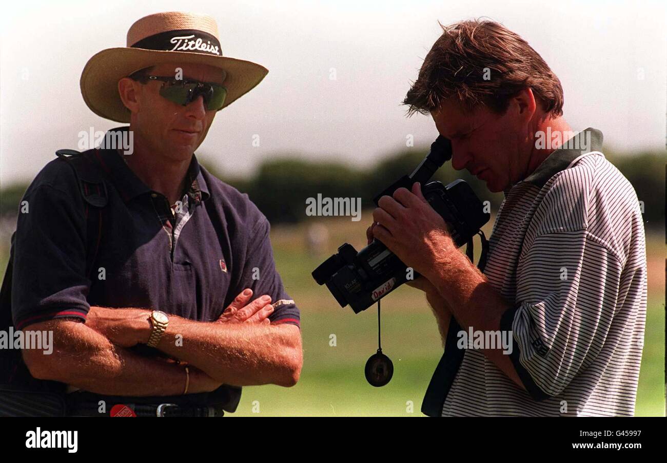 Nick Faldo uses video playback to check his form with the help of his coach David Leadbetter (left) during his practice round today (Monday) at the Royal Lytham & St Annes golf course prior to competing in the British Open later this week. By Adam Butler/PA. Stock Photo