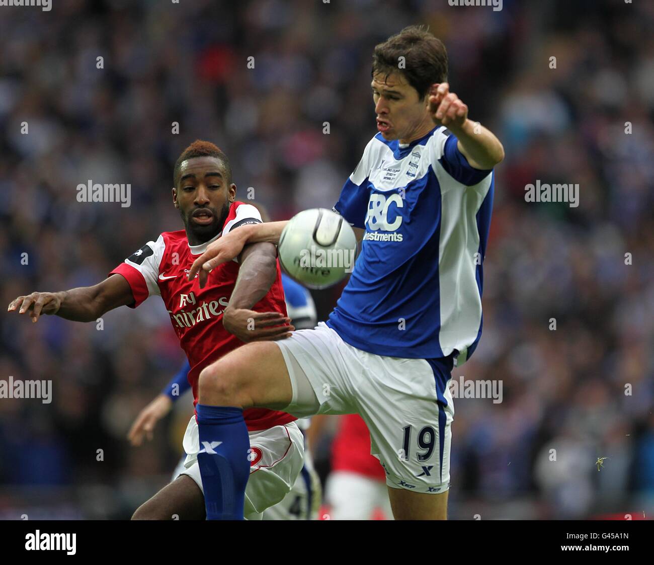 Soccer - Carling Cup - Final - Arsenal v Birmingham City - Wembley Stadium. Birmingham City's Nikola Zigic (right) and Arsenal's Johan Djourou battle for the ball Stock Photo
