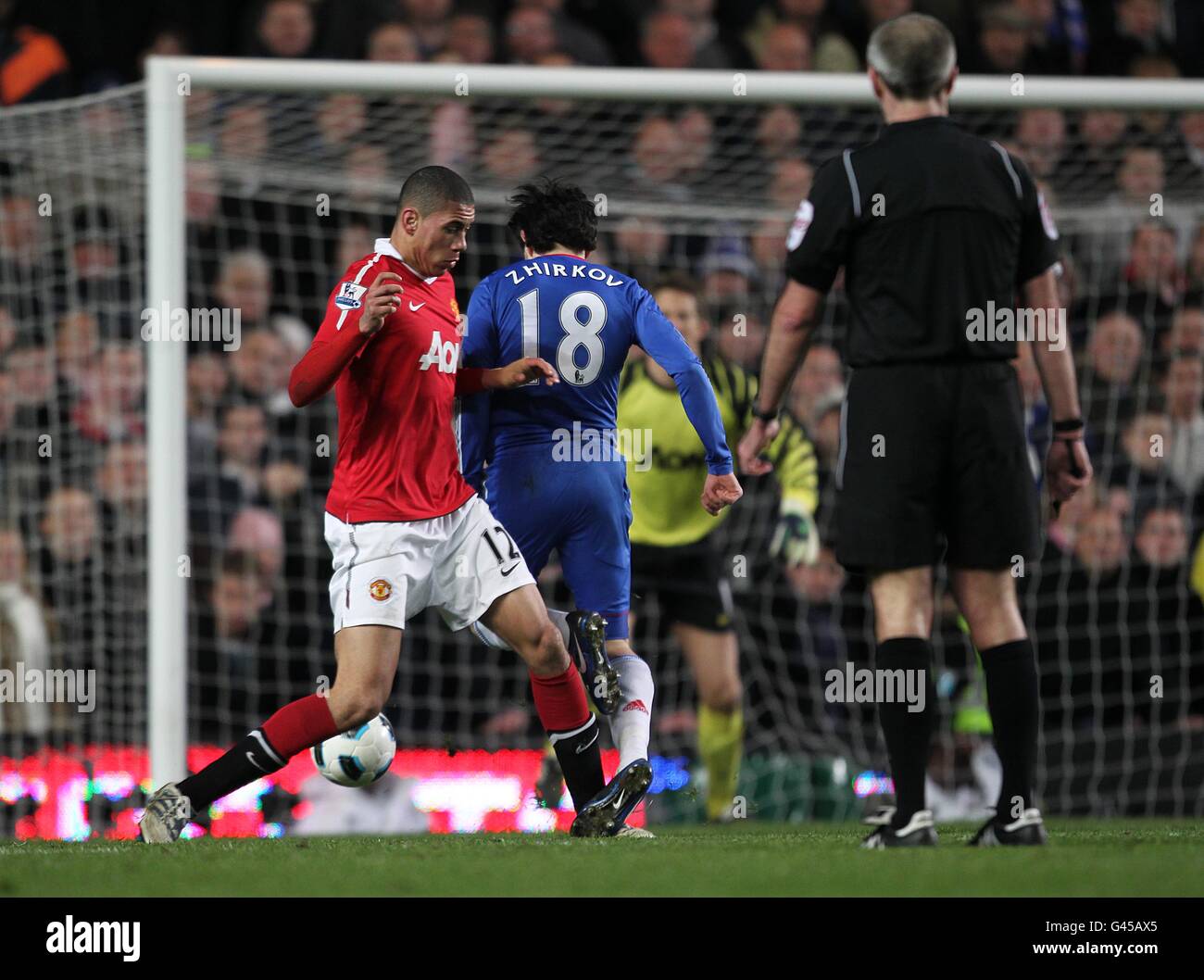 Soccer - Barclays Premier League - Chelsea v Manchester United - Stamford Bridge. Manchester United's Chris Smalling concedes a penalty for a foul on Chelseas's Yury Zhirkov Stock Photo