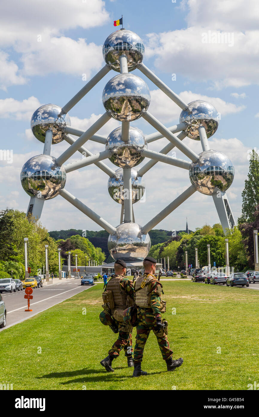 The Atomium in Brussels, Belgium, at the exhibition grounds, armed soldiers on patrol, security forces, Stock Photo