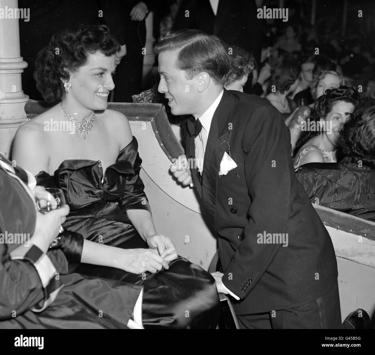 Film - Annual Film Ball - London. American actress Jane Russell chats to Richard Attenborough at an annual film ball. Stock Photo