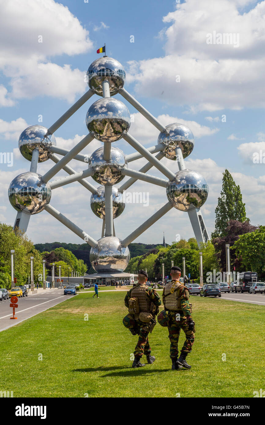 The Atomium in Brussels, Belgium, at the exhibition grounds, armed soldiers on patrol, security forces, Stock Photo