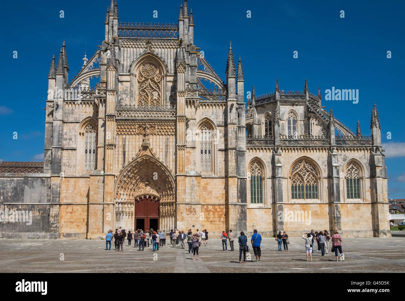 Tourists at Batalha Monastery (Mosteiro da Batalha), a UNESCO World Heritage Site, Batalha, Portugal Stock Photo