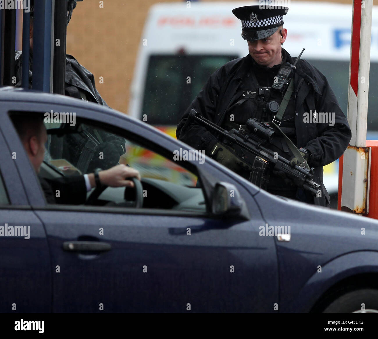 . Armed Police outside Govan Police station in Glasgow, after a man was arrested in connection with the Stockholm suicide bombing last year. Stock Photo