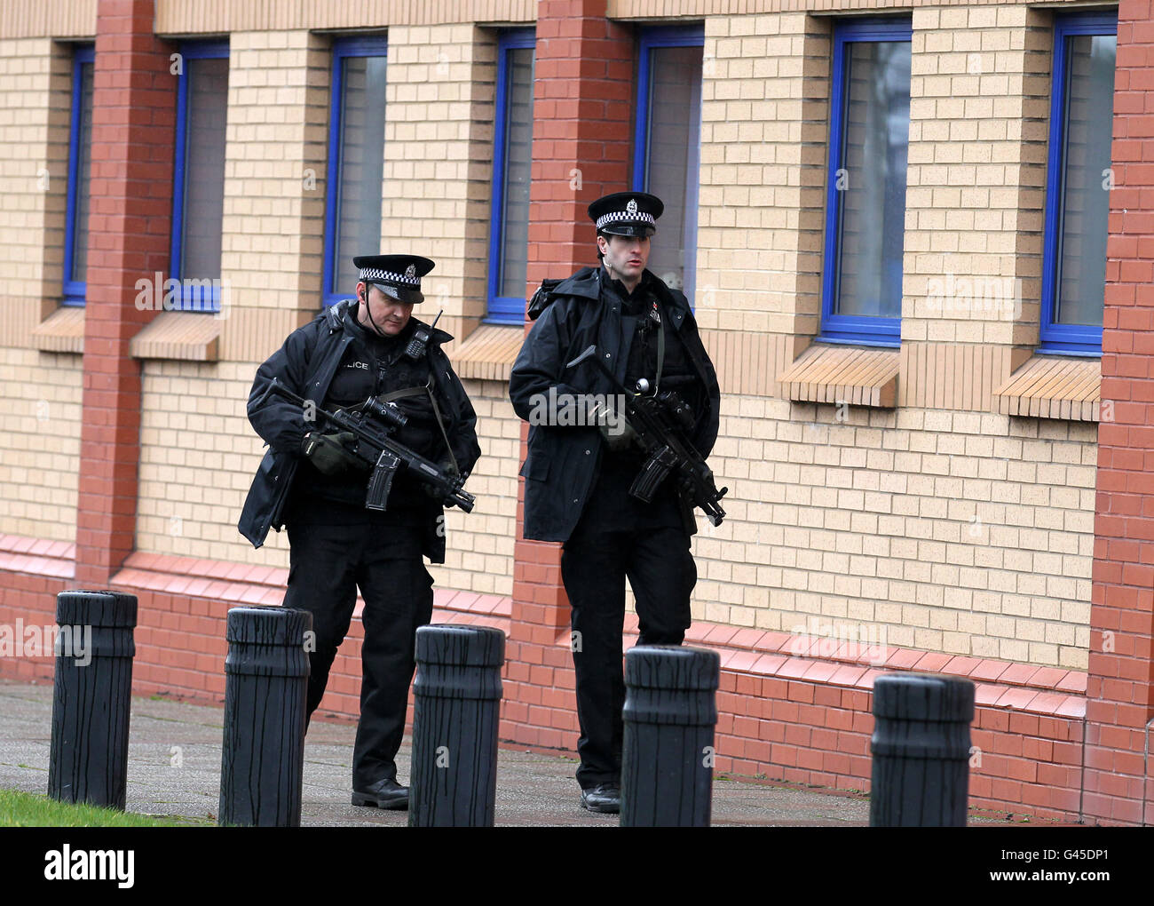 Armed Police outside Govan Police station in Glasgow, after a man was arrested in connection with the Stockholm suicide bombing last year. The foreign national was arrested under the Terrorism Act shortly after 6am in the Whiteinch area of the city. Stock Photo