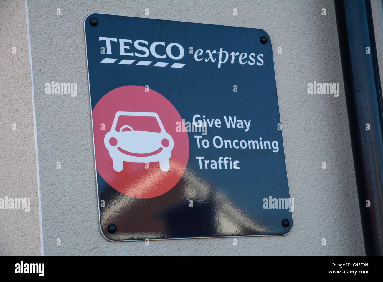 A Tesco express give way sign. Stock Photo